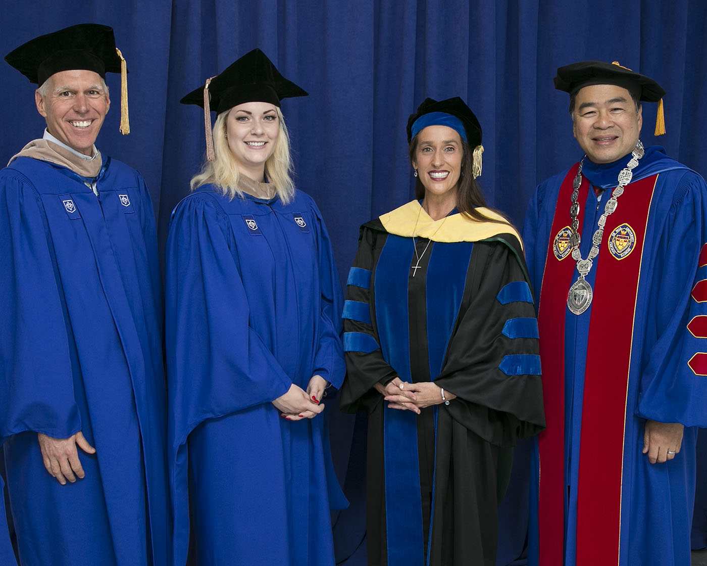 James T. Ryan III, chair of the board of trustees; Alyssa Poniatowski, Class of 2018 student speaker; Misty M. Johanson, dean of the Driehaus College of Business; and A. Gabriel Esteban, Ph.D., president of DePaul at the Wintrust Arena